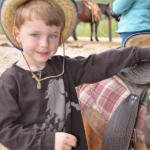 little boy near horse